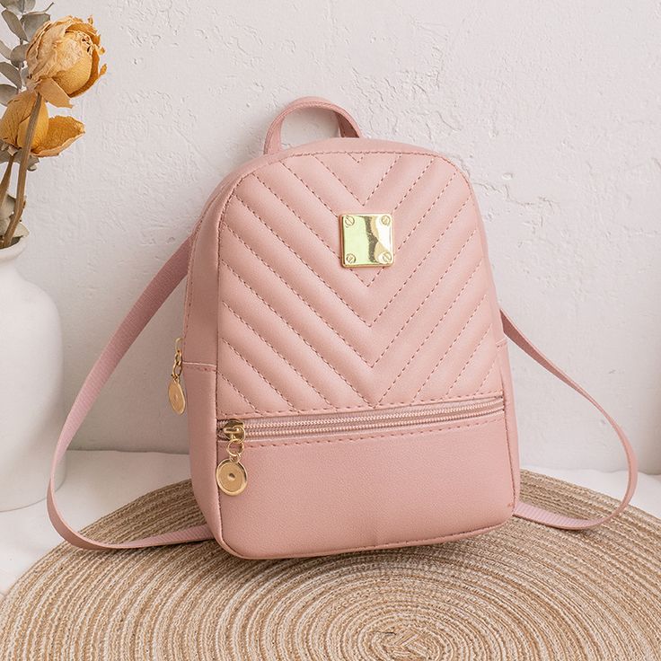 Pink Violet backpack handbag on a neutral background